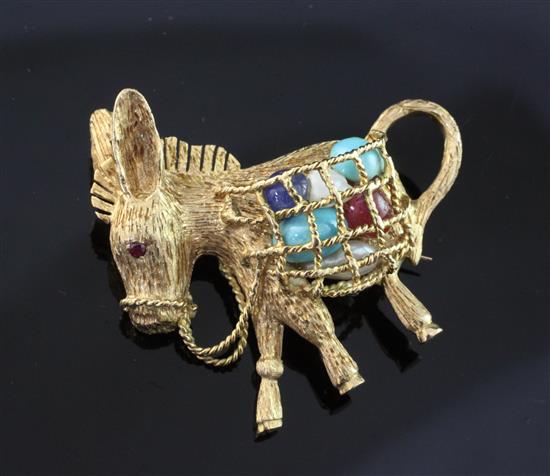 An 18ct gold brooch modeled as a donkey carrying a pannier filled with gems and baroque pearls, 1.5in.